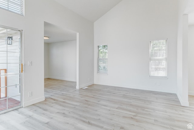 415 E Acoma Rd S, Midvale, UT 84047 - empty room with high vaulted ceiling and wood finished floors