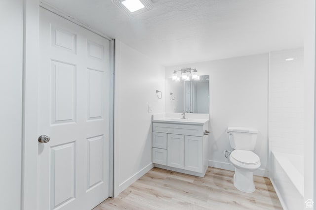 415 E Acoma Rd S, Midvale, UT 84047 - bathroom with vanity, wood finished floors, and a textured ceiling