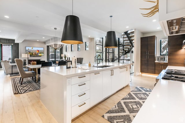 552 Deer Valley Dr, Park City, UT 84060 - kitchen with modern cabinets, light wood finished floors, white cabinetry, light countertops, and recessed lighting