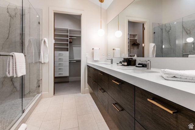 552 Deer Valley Dr, Park City, UT 84060 - bathroom with a spacious closet, double vanity, a marble finish shower, tile patterned flooring, and lofted ceiling