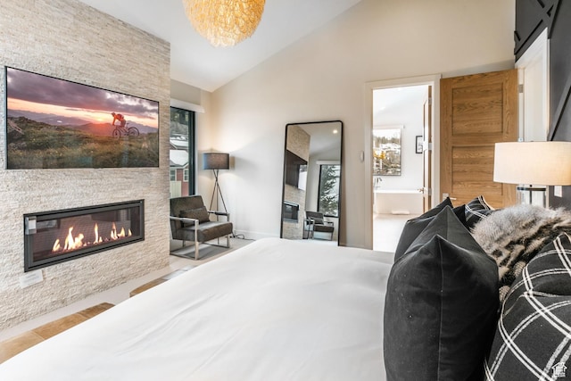 552 Deer Valley Dr, Park City, UT 84060 - bedroom with a stone fireplace and vaulted ceiling