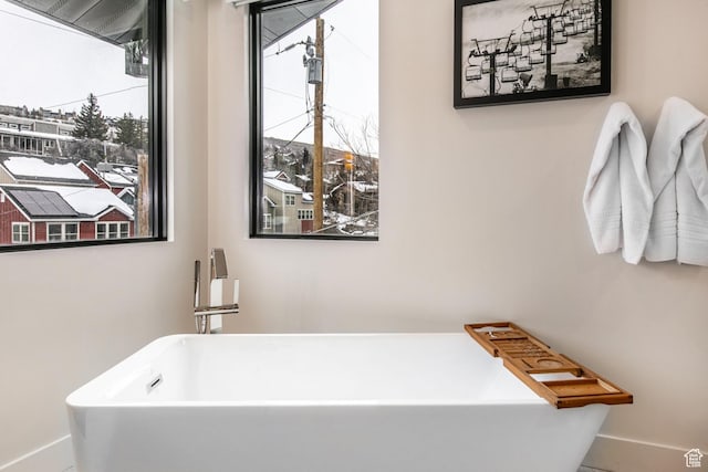 552 Deer Valley Dr, Park City, UT 84060 - bathroom featuring a soaking tub and baseboards