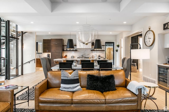 552 Deer Valley Dr, Park City, UT 84060 - living area with light wood-style flooring, beverage cooler, a chandelier, and recessed lighting