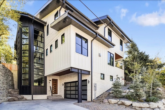 552 Deer Valley Dr, Park City, UT 84060 - view of property featuring a garage and driveway