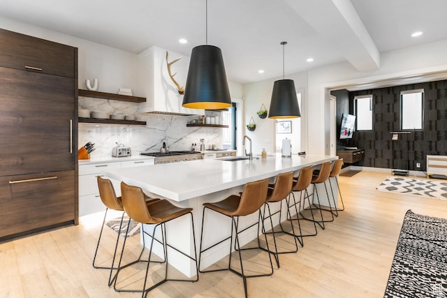 552 Deer Valley Dr, Park City, UT 84060 - kitchen with open shelves, light wood-style floors, backsplash, light countertops, and recessed lighting