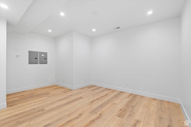 5554 N Fox Canyon Rd, Lehi, UT 84043 - unfurnished room featuring electric panel, recessed lighting, and light wood-type flooring