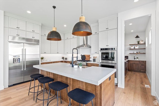 5554 N Fox Canyon Rd, Lehi, UT 84043 - kitchen with appliances with stainless steel finishes, light countertops, light wood-style floors, white cabinets, and recessed lighting