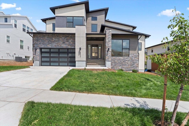 5554 N Fox Canyon Rd, Lehi, UT 84043 - contemporary house with stone siding, driveway, an attached garage, and a front yard