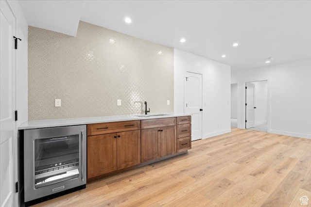 5554 N Fox Canyon Rd, Lehi, UT 84043 - bar with wine cooler, light wood-type flooring, recessed lighting, and backsplash