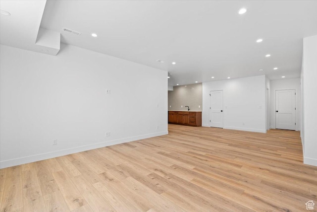 5554 N Fox Canyon Rd, Lehi, UT 84043 - unfurnished living room featuring light wood finished floors and recessed lighting