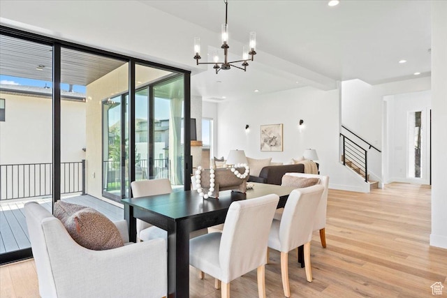 5554 N Fox Canyon Rd, Lehi, UT 84043 - dining area with a chandelier, light wood-style flooring, stairway, and recessed lighting