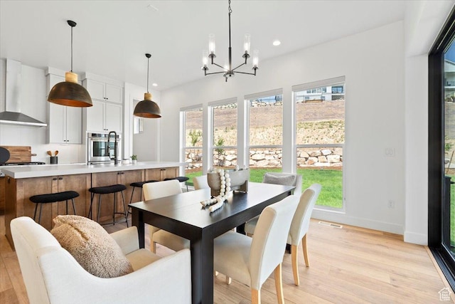 5554 N Fox Canyon Rd, Lehi, UT 84043 - dining area featuring recessed lighting, light wood-type flooring, and a chandelier