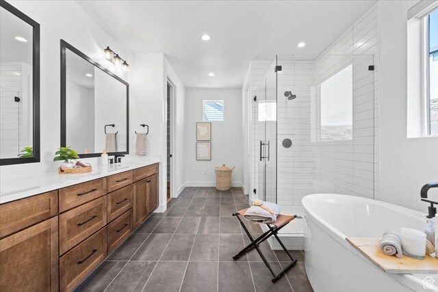 5554 N Fox Canyon Rd, Lehi, UT 84043 - bathroom with a freestanding tub, a shower stall, double vanity, recessed lighting, and tile patterned floors