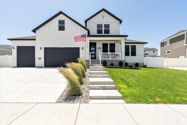 2847 S Puddle Ln S, Saratoga Springs, UT 84045 - view of front of home with a porch, board and batten siding, concrete driveway, and an attached garage