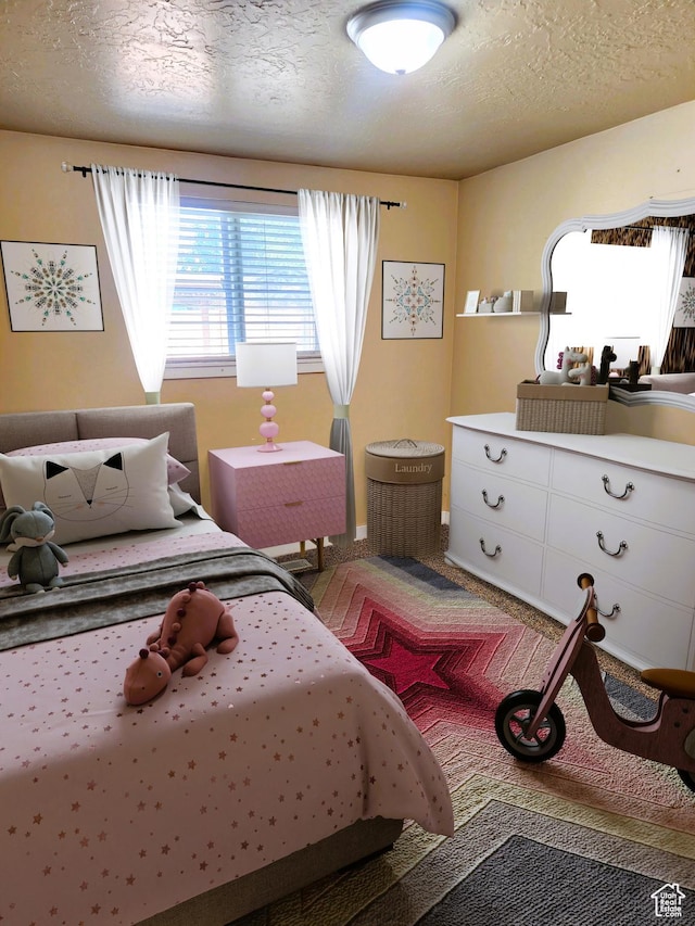 464 N Grant St, Salt Lake City, UT 84116 - carpeted bedroom featuring a textured ceiling and baseboards