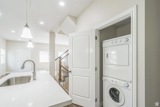 3872 S 1630 W, West Valley City, UT 84119 - laundry area featuring stacked washer / dryer, healthy amount of natural light, and recessed lighting