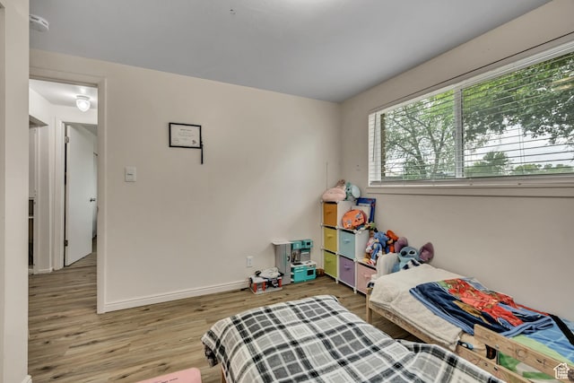 222 W Center St S, Midvale, UT 84047 - bedroom with light wood-type flooring and baseboards