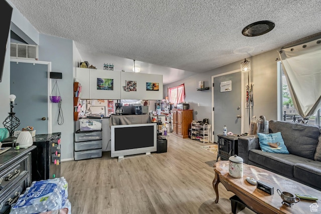 222 W Center St S, Midvale, UT 84047 - living area featuring a textured ceiling and wood finished floors
