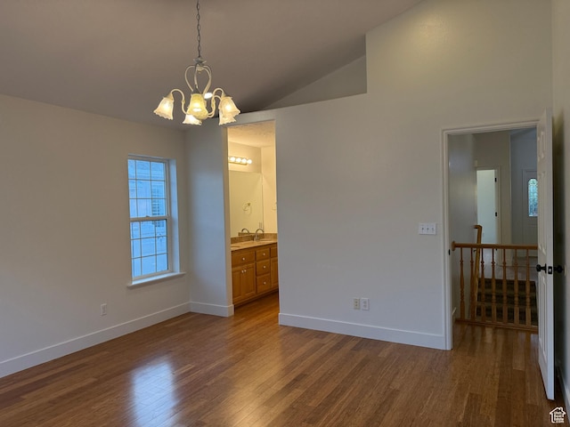 511 W 40 N, Orem, UT 84057 - unfurnished room with dark wood-style floors, a chandelier, and vaulted ceiling