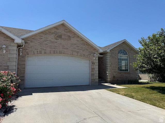 511 W 40 N, Orem, UT 84057 - single story home with concrete driveway, a garage, brick siding, a front yard, and roof with shingles