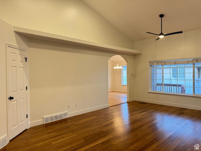 511 W 40 N, Orem, UT 84057 - empty room with a ceiling fan, wood finished floors, lofted ceiling, arched walkways, and a chandelier