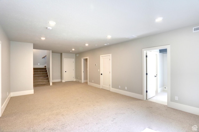 435 E Maple St, Mapleton, UT 84664 - unfurnished living room with light colored carpet, stairs, and recessed lighting