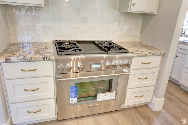 435 E Maple St, Mapleton, UT 84664 - kitchen featuring high end stainless steel range, light wood finished floors, and white cabinetry
