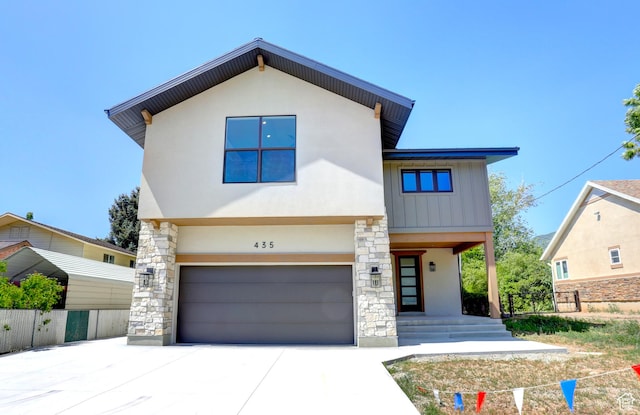 435 E Maple St, Mapleton, UT 84664 - contemporary house with an attached garage, driveway, stucco siding, and stone siding