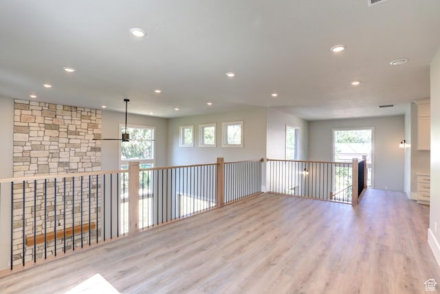 435 E Maple St, Mapleton, UT 84664 - empty room with healthy amount of natural light, recessed lighting, and wood finished floors