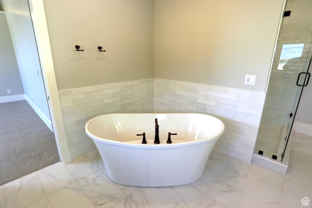 435 E Maple St, Mapleton, UT 84664 - full bath with tile walls, marble finish flooring, a soaking tub, a shower stall, and a wainscoted wall