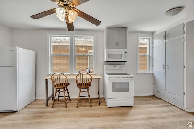 733 E Linden Ave, Salt Lake City, UT 84102 - kitchen featuring white appliances, light wood-type flooring, a ceiling fan, and gray cabinetry