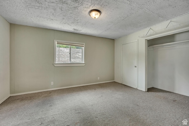 733 E Linden Ave, Salt Lake City, UT 84102 - unfurnished bedroom with carpet floors, a textured ceiling, and a closet