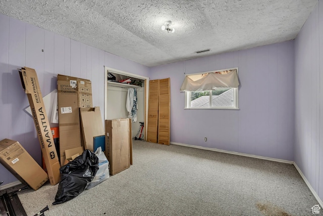 733 E Linden Ave, Salt Lake City, UT 84102 - unfurnished bedroom with carpet flooring, a textured ceiling, and a closet