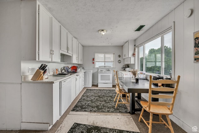733 E Linden Ave, Salt Lake City, UT 84102 - kitchen with white appliances, washer / clothes dryer, white cabinets, light countertops, and a textured ceiling