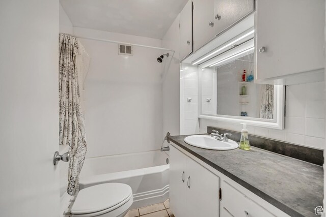 733 E Linden Ave, Salt Lake City, UT 84102 - full bath with vanity, shower / bathtub combination with curtain, tile patterned flooring, and backsplash