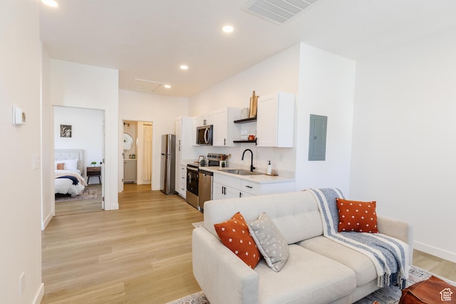 221 E 8th S, Ogden, UT 84401 - living area featuring electric panel, attic access, light wood finished floors, and recessed lighting