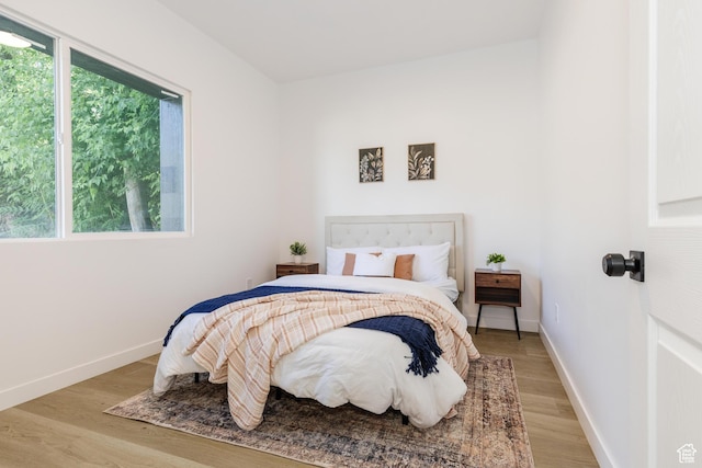 221 E 8th S, Ogden, UT 84401 - bedroom featuring light wood-style floors and baseboards