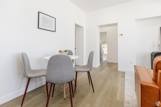221 E 8th S, Ogden, UT 84401 - dining room with light wood-style floors and baseboards