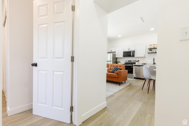 221 E 8th S, Ogden, UT 84401 - corridor with light wood-type flooring and recessed lighting