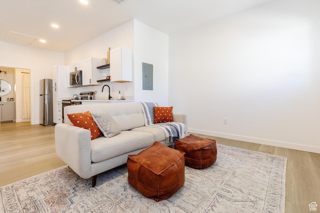 221 E 8th S, Ogden, UT 84401 - living area with electric panel, light wood-type flooring, attic access, and recessed lighting