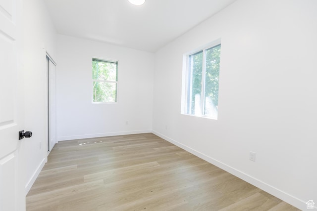 221 E 8th S, Ogden, UT 84401 - unfurnished bedroom featuring light wood finished floors and a closet