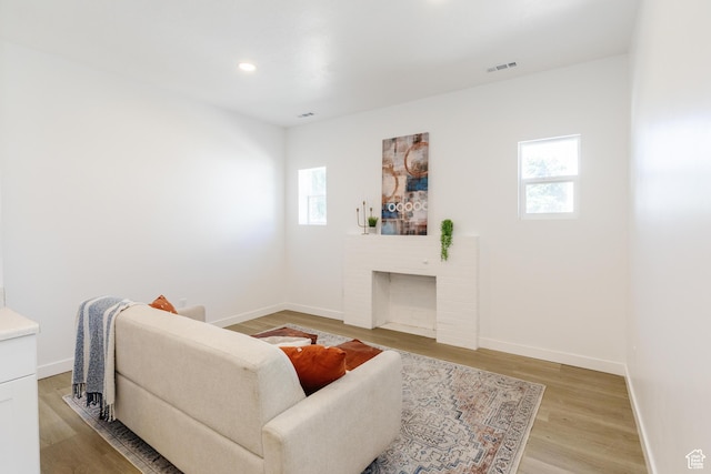 221 E 8th S, Ogden, UT 84401 - living room featuring light wood-type flooring, a fireplace, and recessed lighting