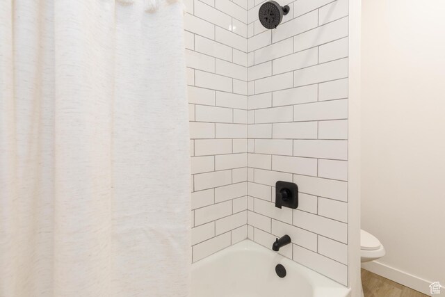 221 E 8th S, Ogden, UT 84401 - bathroom featuring wood finished floors and bathing tub / shower combination