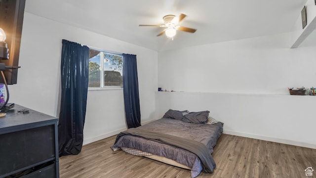636 Downs Dr, Ogden, UT 84404 - bedroom featuring wood finished floors and a ceiling fan