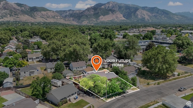 636 Downs Dr, Ogden, UT 84404 - aerial view of residential area with a mountainous background and property boundaries highlighted