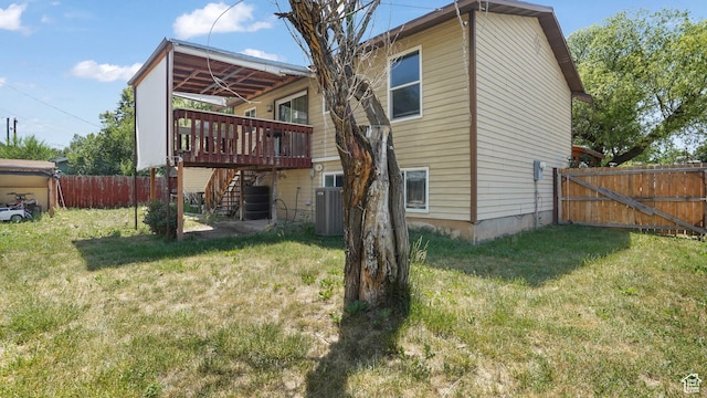 636 Downs Dr, Ogden, UT 84404 - back of property featuring stairs, a fenced backyard, and a wooden deck