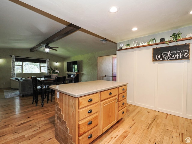 12615 S Dunhammer Dr, Riverton, UT 84065 - kitchen featuring light wood-type flooring, a ceiling fan, light countertops, open floor plan, and a center island