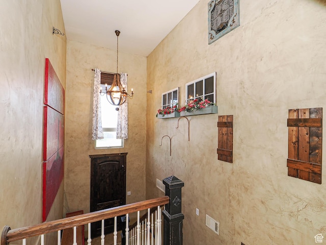 12615 S Dunhammer Dr, Riverton, UT 84065 - corridor with a chandelier