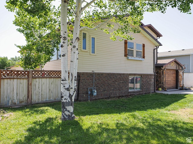 12615 S Dunhammer Dr, Riverton, UT 84065 - view of side of home with brick siding and a garage