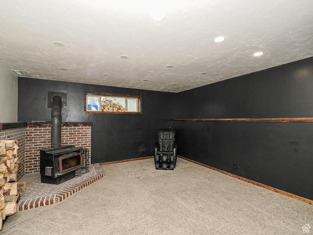 12615 S Dunhammer Dr, Riverton, UT 84065 - below grade area featuring carpet flooring, a wood stove, and recessed lighting
